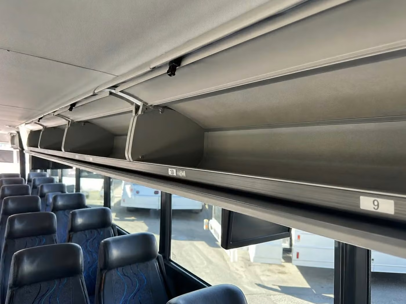 banning 25 passenger minibus overhead storage