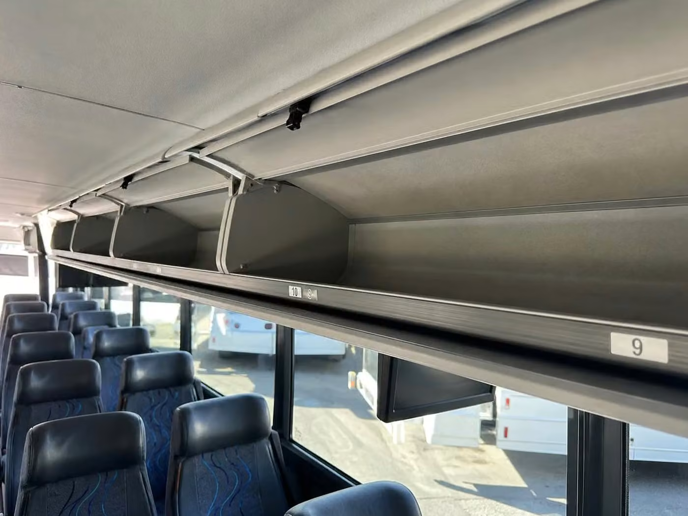 banning 28 passenger minibus overhead storage