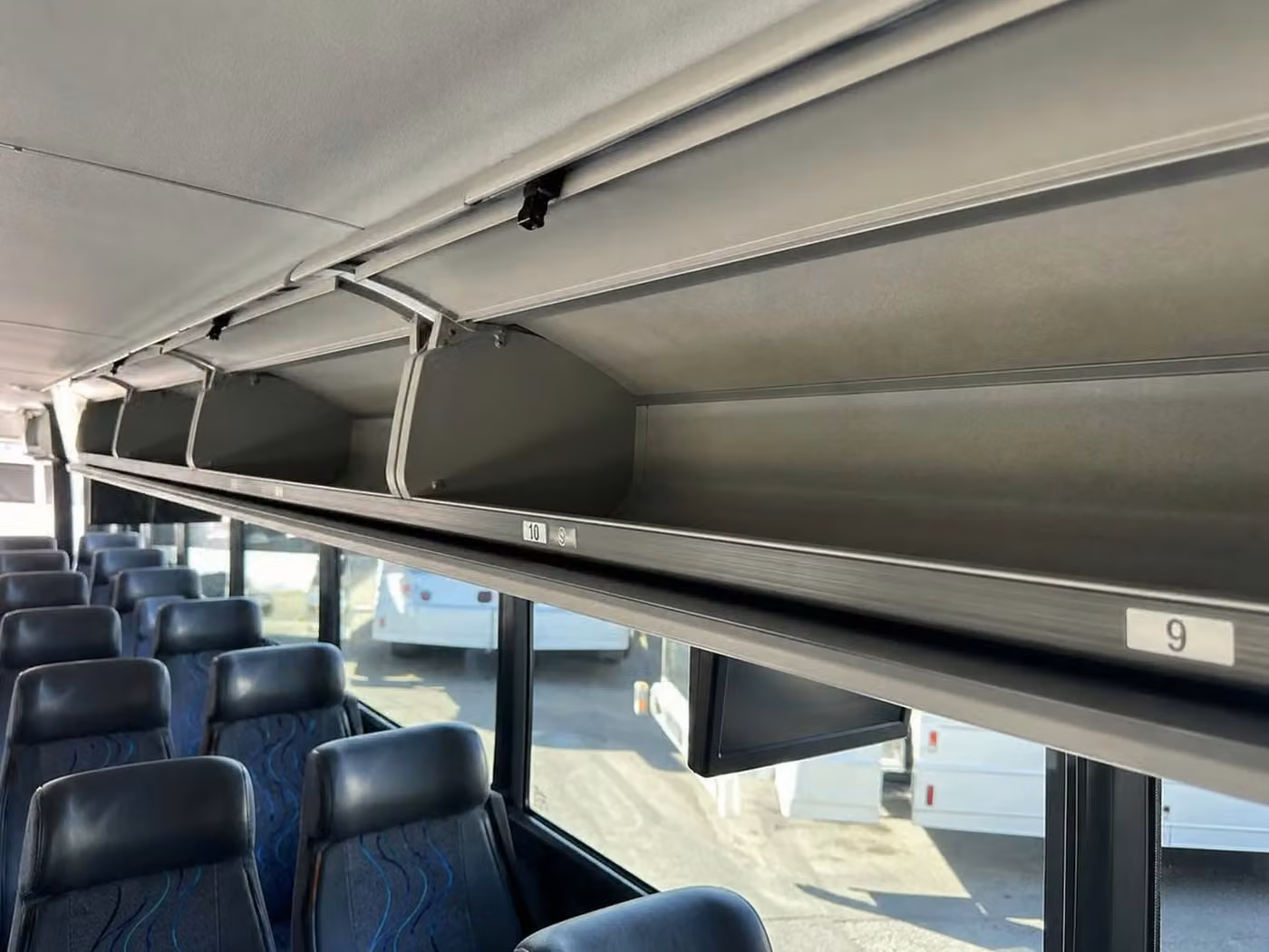 banning 35 passenger minibus overhead storage